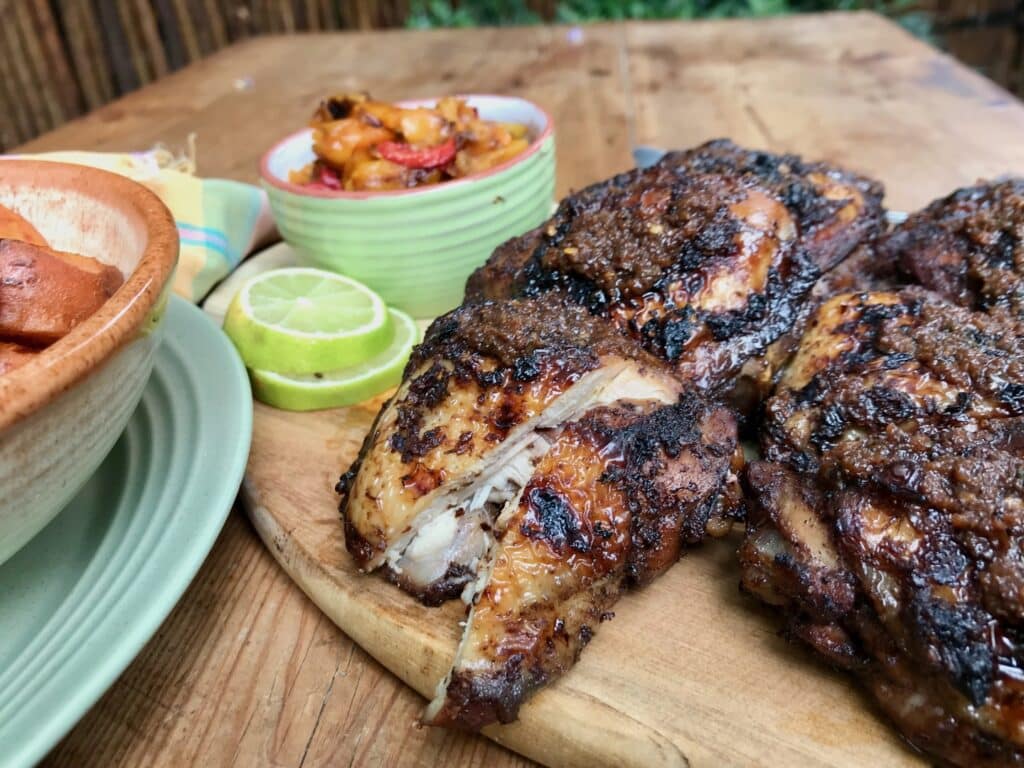 Jamaican jerk chicken, ready to serve with sides