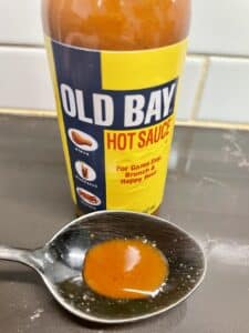 Old Bay Hot Sauce on a spoon