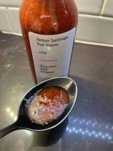 Señor Lechuga Hot Sauce on a spoon