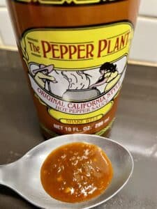 The Pepper Plant Hot Sauce on a spoon