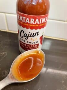 Zatarain's Cajun Hot Sauce on a spoon